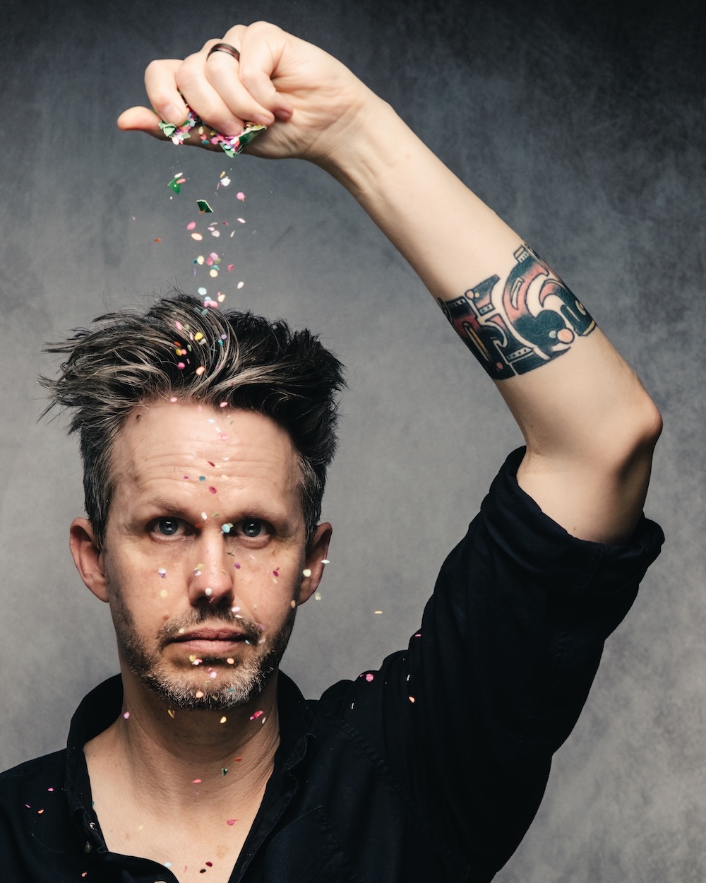 Noah Masterson cracking a confetti egg on his head, photo by John Cuba Lewis