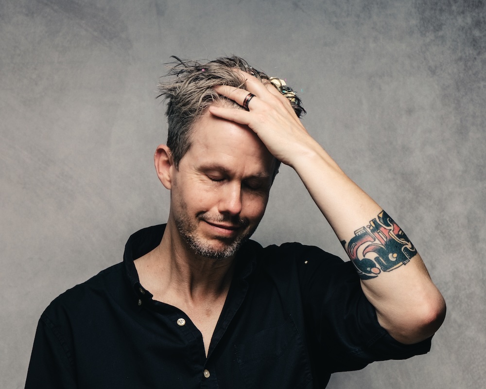 Noah Masterson, hand on forehead, photo by John Cuba Lewis
